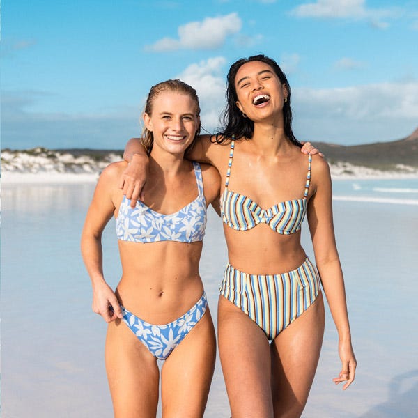 Jamaica Selby and Crystal Ngo laughing on the beach in Western Australia