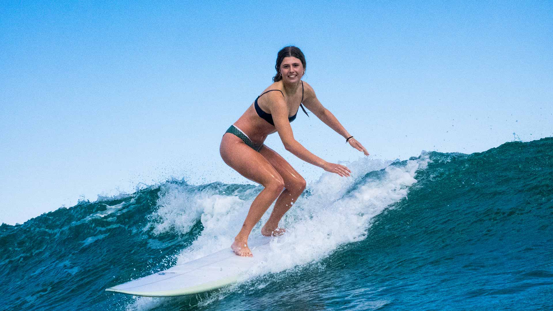 Surfer surfing a Rip Curl board.