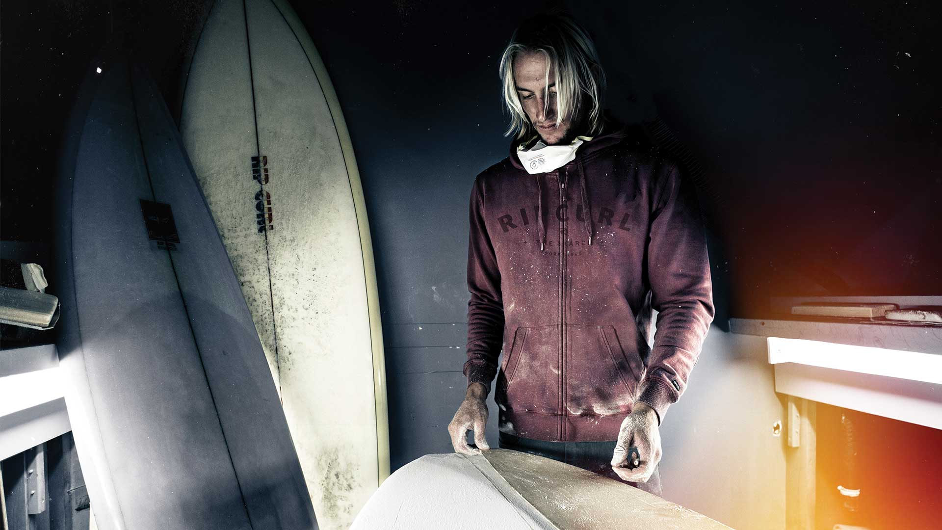 Owen Wright shaping a surfboard.